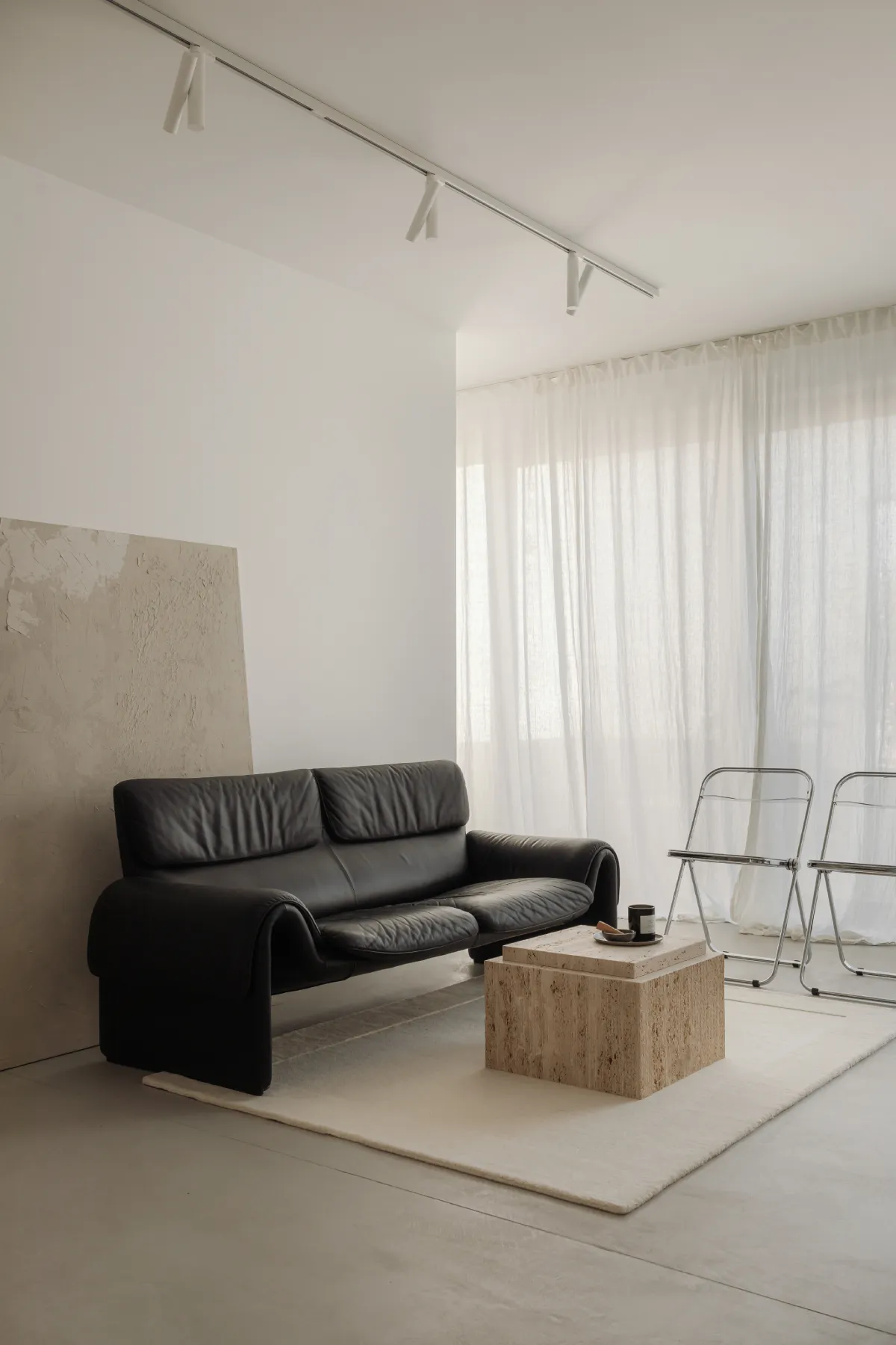 kaboompics_interior-inspo-warm-minimalist-living-room-de-sede-ds-2011-leather-sofa-and-travertine-furniture-36458